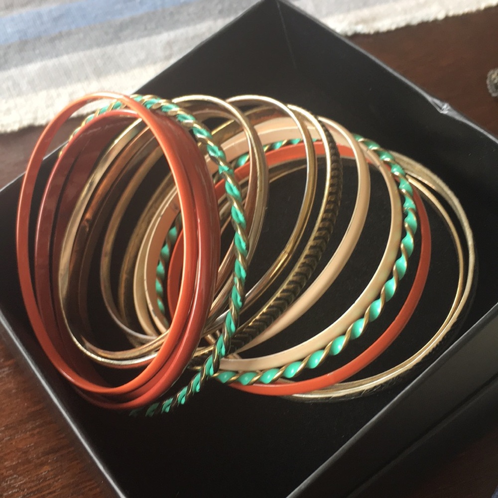 Collection of bangle bracelets, multiple colors.